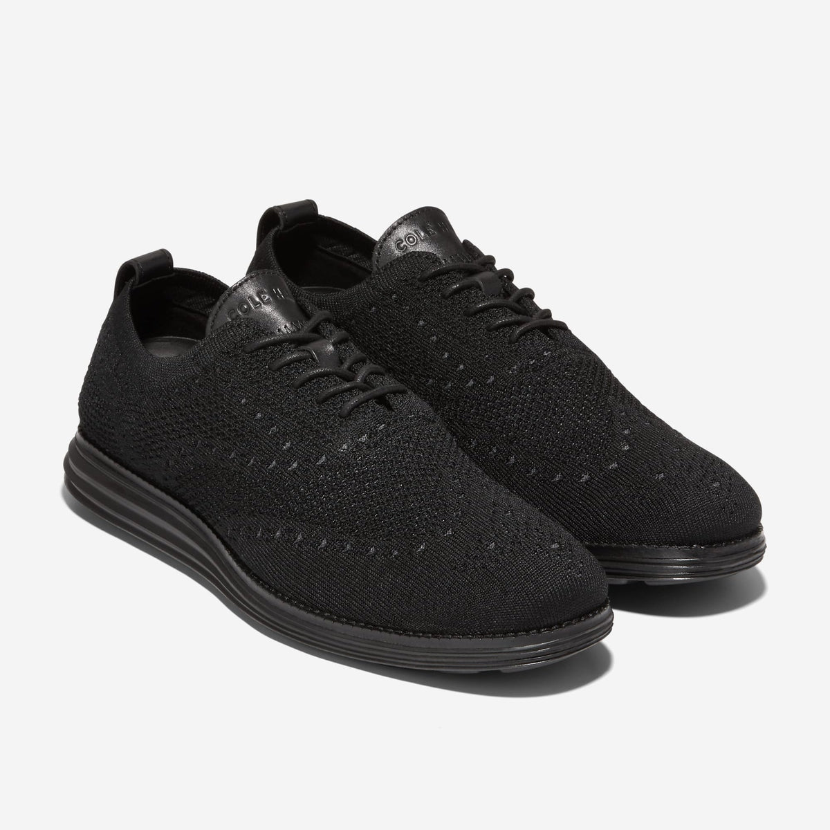 Cole Haan Grand Knit Wingtip II Oxford in black, three-quarter view