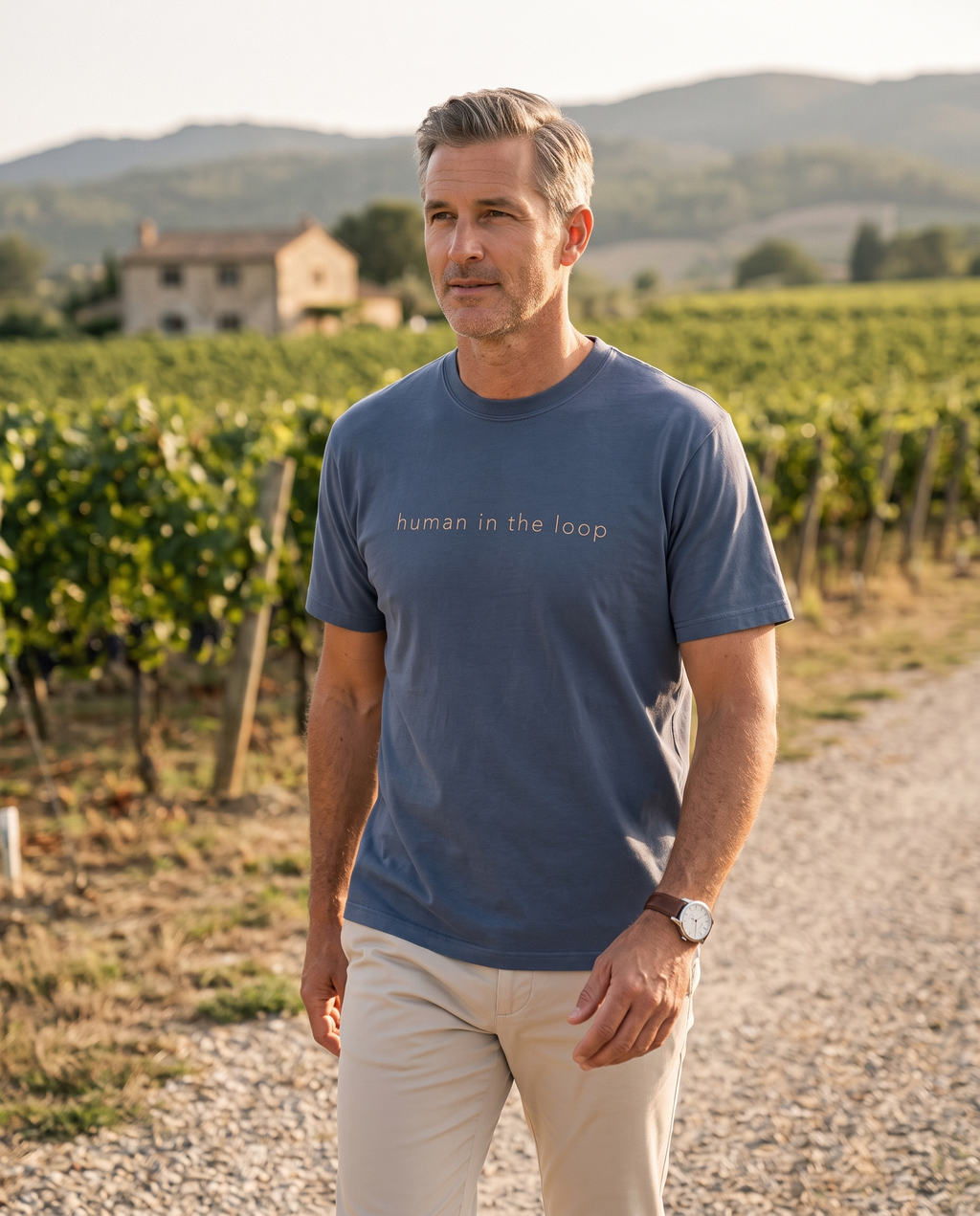 The Human in the Loop Tee worn on a vineyard path