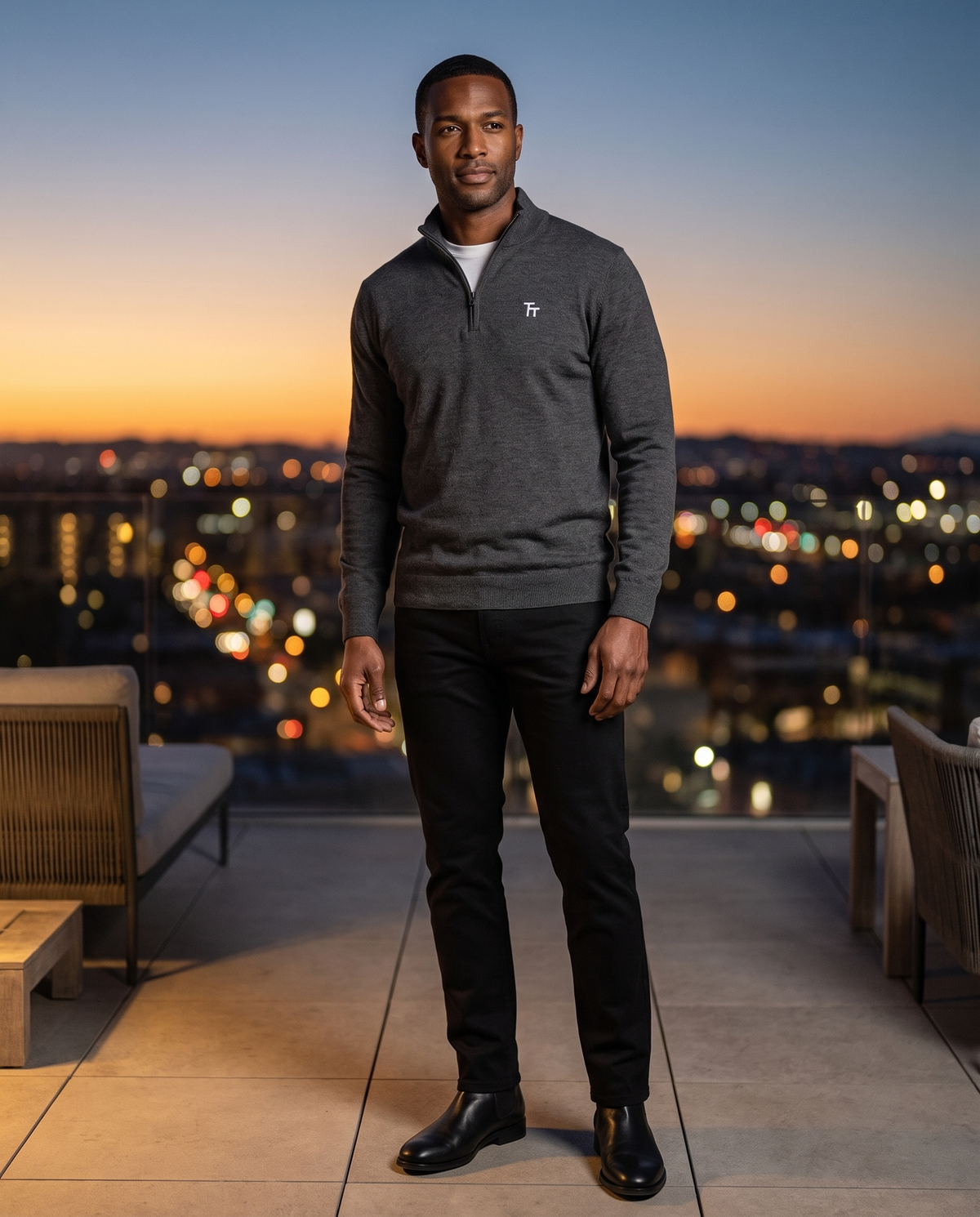 Super-Stretch Chino in Black with the Tri-Blend Quarter-Zip on a rooftop at dusk