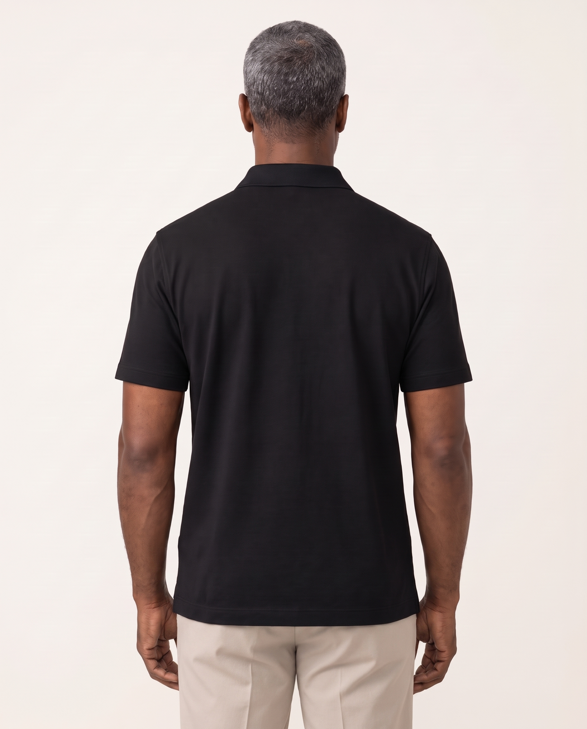 The Back Nine Polo by TechThreads, back on model