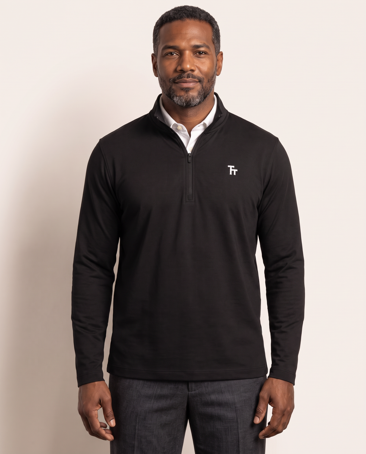The Commit Quarter-Zip by TechThreads, front on model
