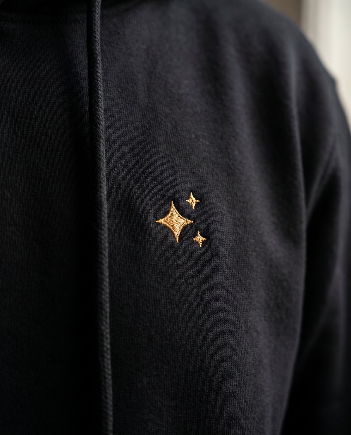 The Spark Hoodie by TechThreads, embroidery close-up