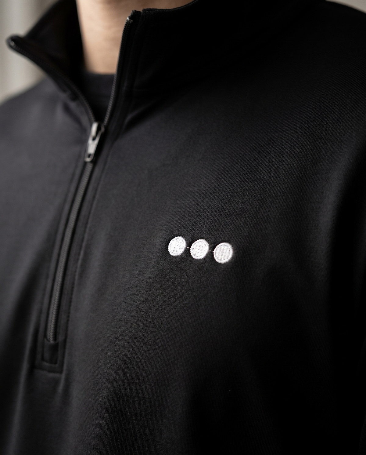 The Ellipsis Quarter-Zip by TechThreads, embroidery close-up
