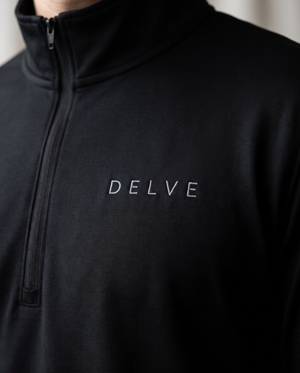 The Delve Quarter-Zip by TechThreads, embroidery close-up