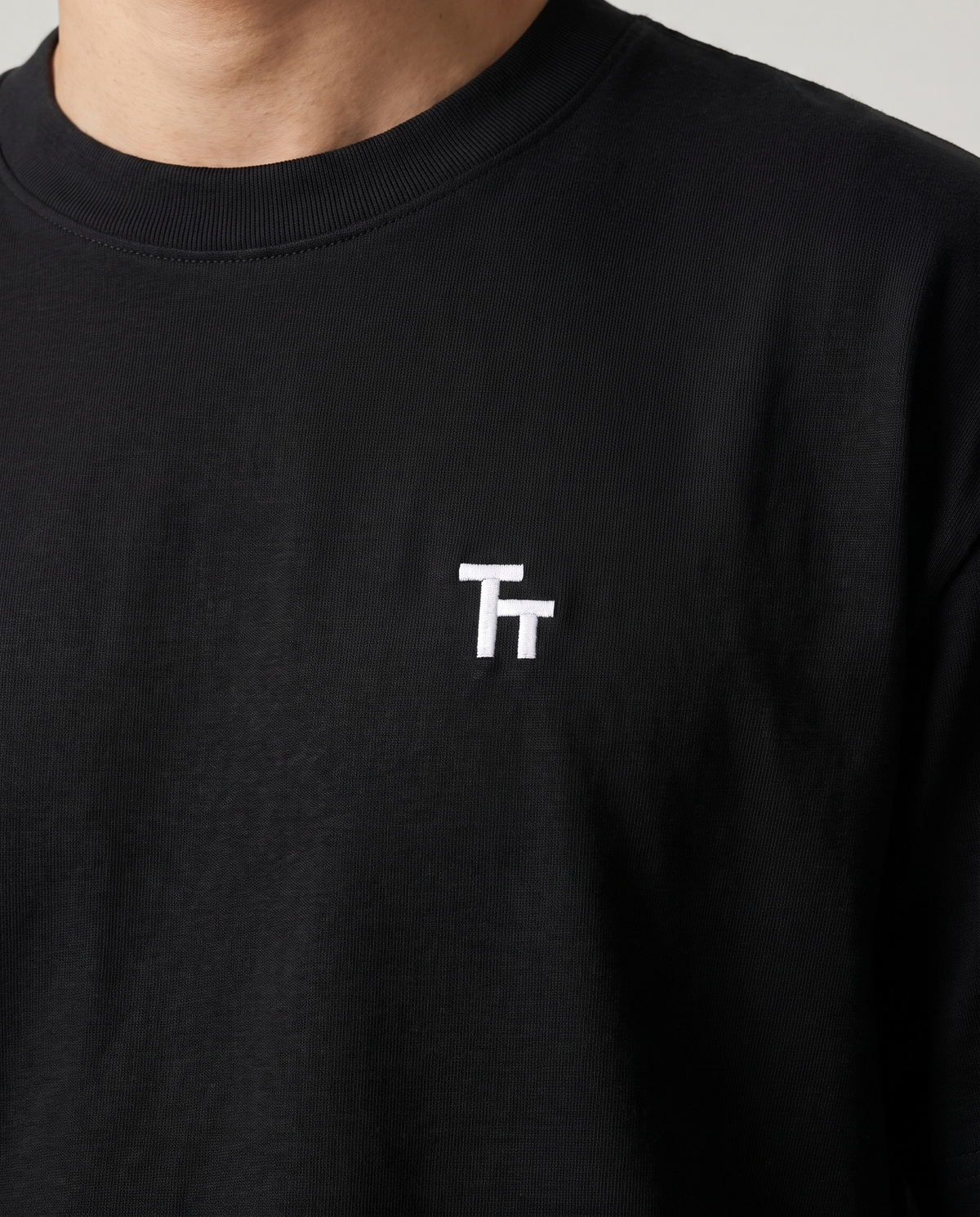 The Baseline Tee by TechThreads, chest logo close-up